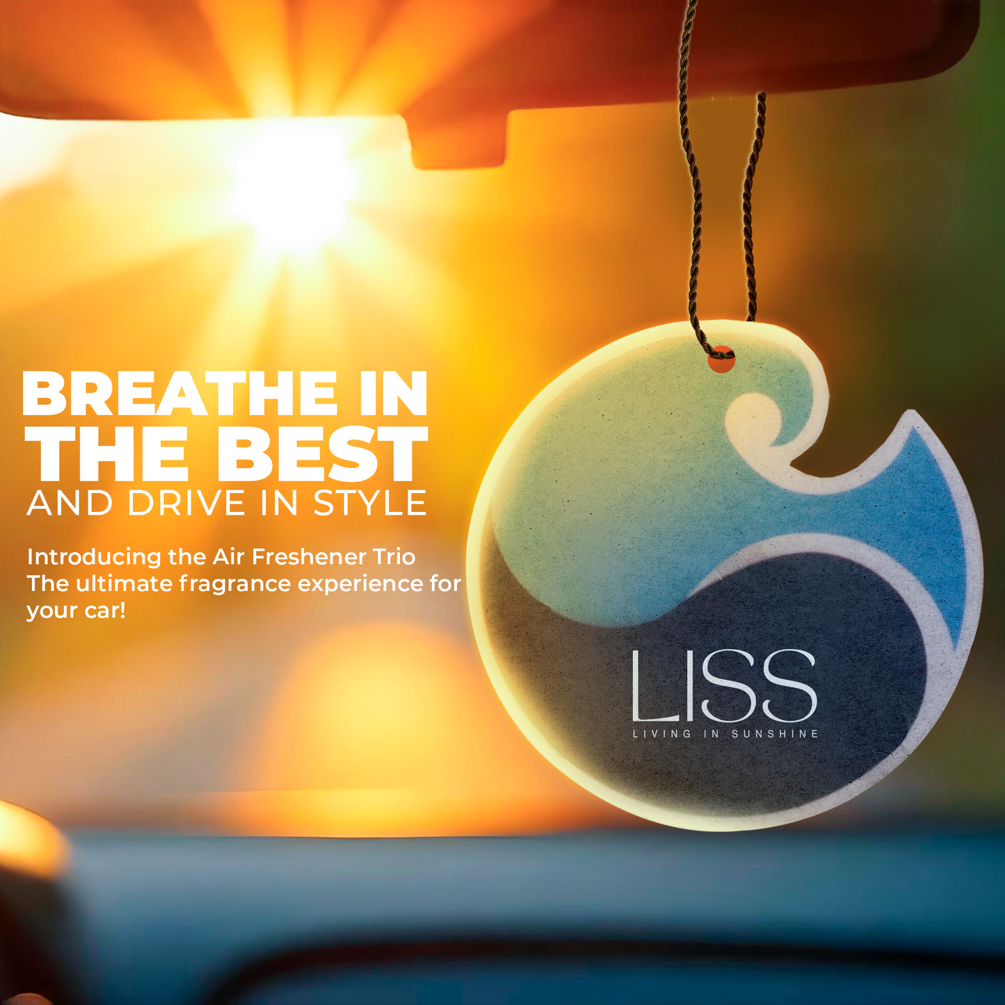 Round LISS car air freshener hanging from rearview mirror with sunlight in background