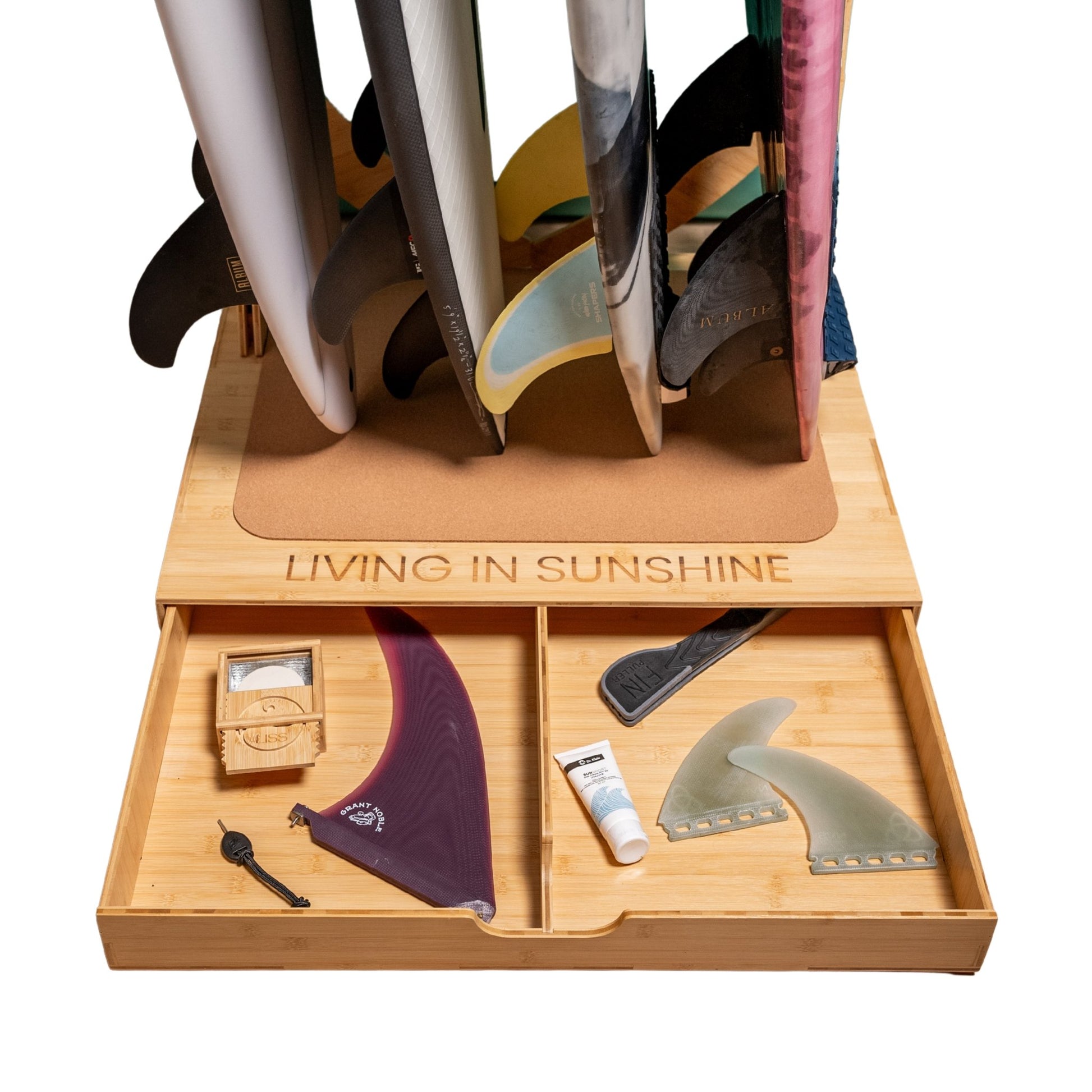 Open Spirit Rack drawer with surf fins, wax, key, and accessories neatly organized.