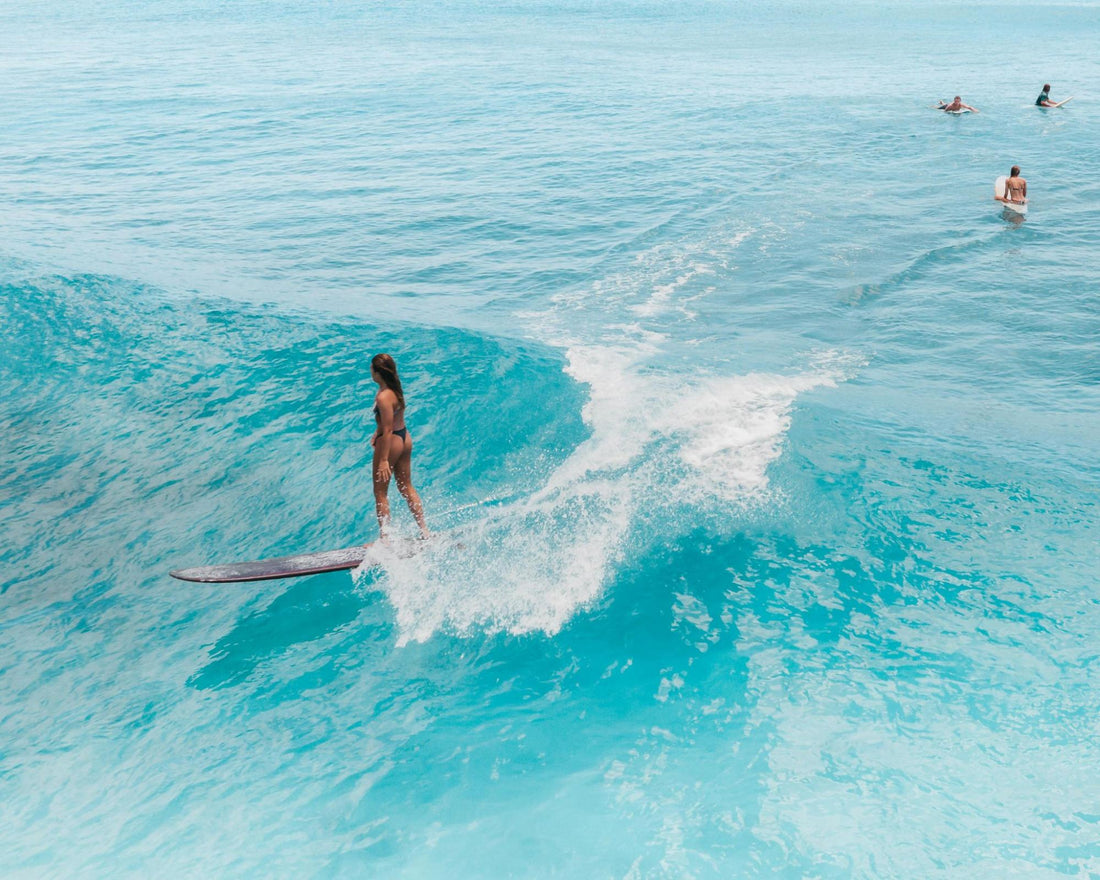 Person surfing on a small wave