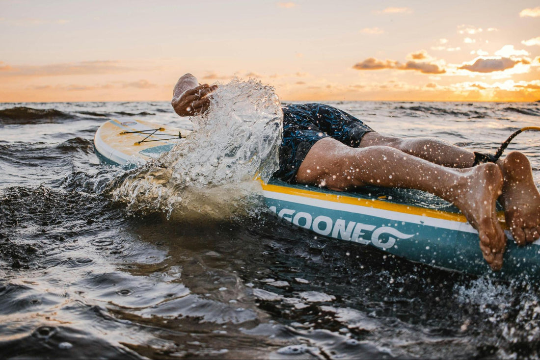 Surfer paddling on a surfboard