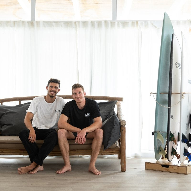Lior Zimmerman and Amit Lavion, founders of Living in Sunshine, with a Spirit Rack and surfboards.