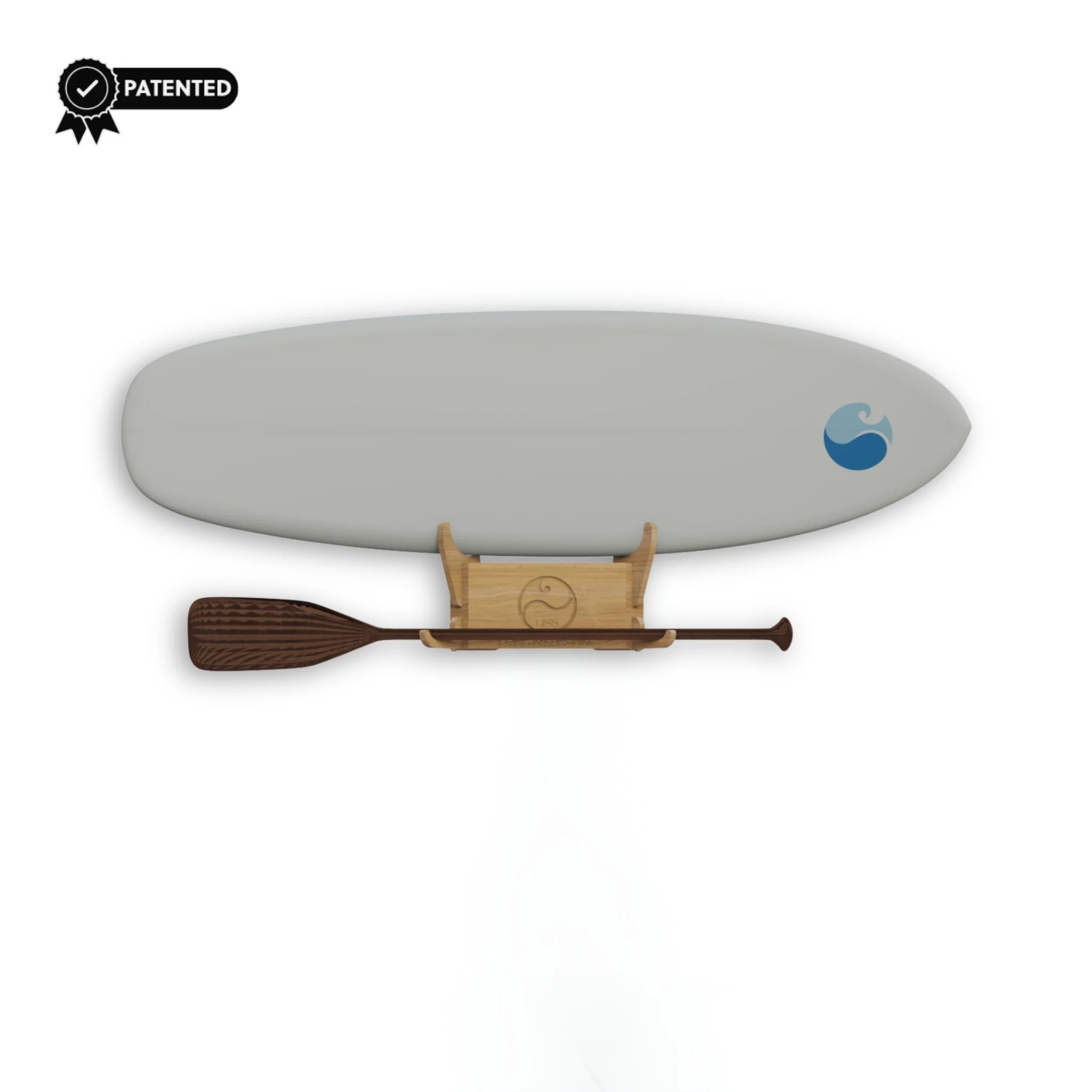 The Solo Rack mounted with a board — minimalist bamboo wall rack on white background.